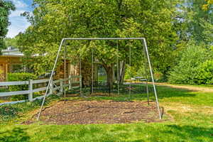 View of jungle gym featuring a yard