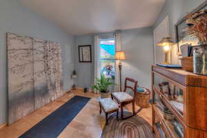 Bedroom 3 featuring vaulted ceiling and light wood-type flooring