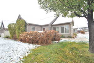 View of front of property with a lawn