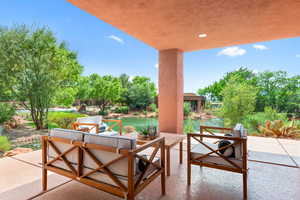 View of patio / terrace with a water view