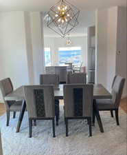 Dining room featuring an inviting chandelier and light hardwood / wood-style floors