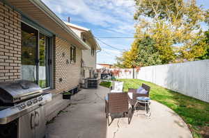 View of patio with area for grilling and central AC