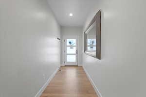 Entryway with light hardwood / wood-style floors