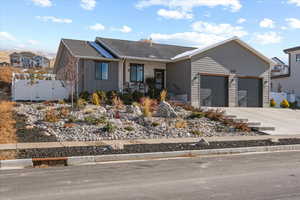 View of front of property featuring a garage