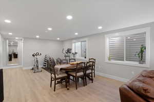 Dining space with light hardwood / wood-style floors