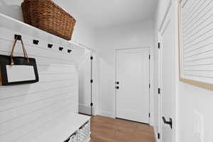 Mudroom featuring light wood-type flooring