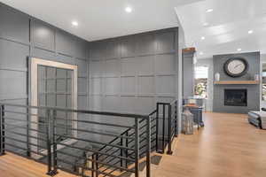 Stairway featuring wood-type flooring