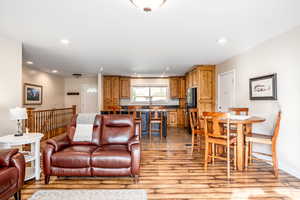 Living room with light hardwood / wood-style flooring