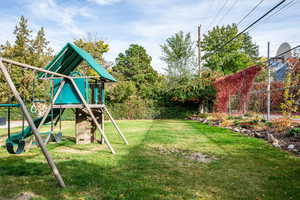 View of yard featuring a playground