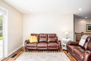 Living room with hardwood / wood-style floors