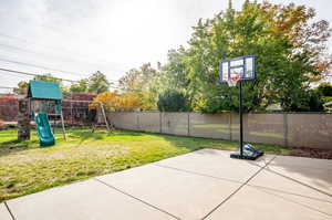 View of patio with a playground