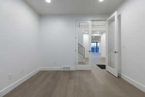 Empty room featuring hardwood / wood-style floors