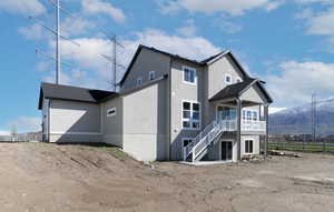 Rear view of house featuring a mountain view