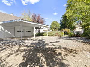 Great location for a future pool behind the detached garage, which features pull through doors on both sides.