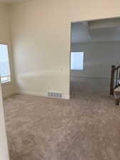 Unfurnished room featuring carpet flooring