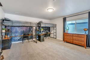 Carpeted bedroom with a textured ceiling