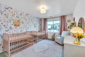 Bedroom featuring a crib