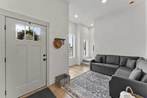 Living room featuring light hardwood / wood-style floors and a wealth of natural light