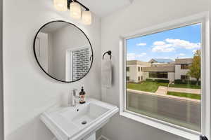 Bathroom featuring sink and a healthy amount of sunlight