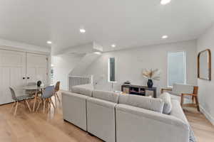 Living room with light wood-type flooring