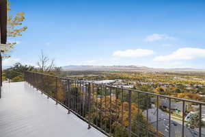 Balcony featuring valley and city views