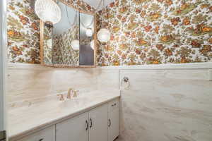 Bathroom with vanity and toilet