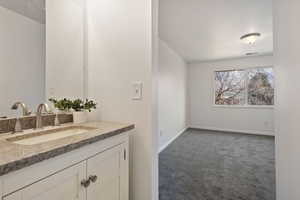 Upstairs Master suite with its own sink and tiled area