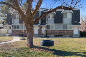 View of front of house with a front yard