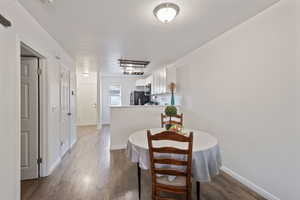 Dining room featuring laminate wood-style floors