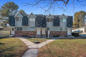 View of front of property featuring a front yard