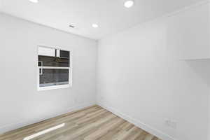 Empty room featuring light hardwood / wood-style flooring