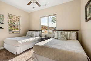 Bedroom featuring ceiling fan and carpet flooring