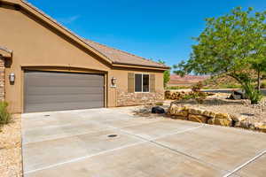 View of front of house with a garage and a mountain view