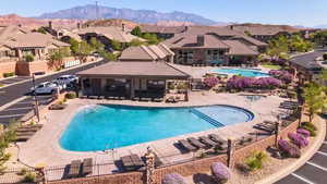 View of pool featuring a mountain view and a patio area