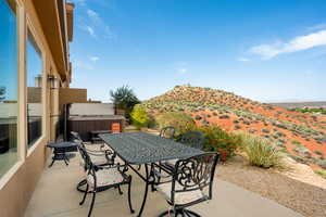 View of patio / terrace featuring a mountain view and a hot tub