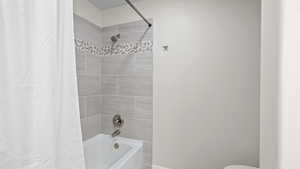 Bathroom with shower / tub combo with curtain