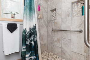 Bathroom featuring walk in shower