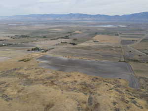 Aerial view featuring a rural view and a mountain view