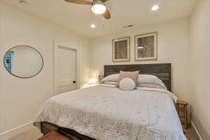 Bedroom with ceiling fan and carpet floors