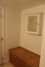 Mudroom featuring light tile patterned flooring