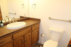 Bathroom featuring vanity and toilet