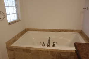 Bathroom with a relaxing tiled tub