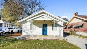 Bungalow-style home featuring a front yard and a porch