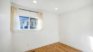 Empty room with wood-type flooring