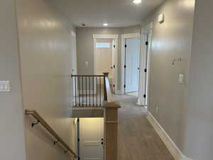 Corridor featuring hardwood / wood-style floors