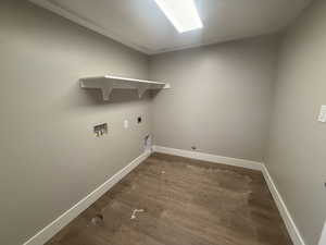 Laundry room with washer hookup, electric dryer hookup, dark hardwood / wood-style flooring, and gas dryer hookup