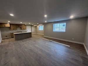 Kitchen featuring hardwood / wood-style floors and a center island