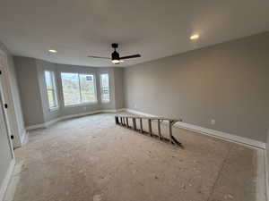 Empty room featuring ceiling fan