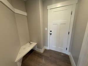 Mudroom with dark hardwood / wood-style floors