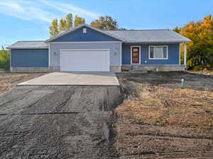 Front of House with Two 2 Car Garages